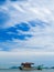 Sky, clouds , sea and fishing boat wrecks.