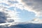 Sky with dark clouds and a skylight in the center, soft focus