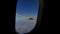Sky and earth through the porthole of a flying airplane, background