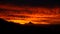 Sky on fire with mordor like volcano at sunset in Nahuel Huapi National Park, Argentina.