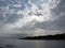 Sky with giants cumulonimbus clouds and silhouette of the tuscan coastline