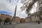 Sky, landmark, town, square, plaza, building, monument, city, tree, obelisk, sedan, cloud, facade