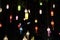 Sky lanterns, flying lanterns, floating lanterns, hot-air balloons on dark night sky with moon. New year and Yeepeng festival