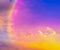 Sky midday sunlight beams rainbow pastel gradient pale orange-pink purple-blue dramatic. Beautiful sunny day soft light clouds