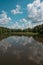 Sky reflected in the river in the woods