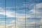 Sky reflection in modern skyscraper window. Cloudscape view reflected in futuristic architectural structure. Abstract view, space