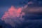 Sky with rose and dark clouds. Heavenly dreamy fluffy colorful fantasy clouds.