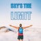 SKY'S THE LIMIT motivation text written on sky background. The sky is the limit for your success. Man with open arms