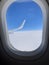 Sky an snowflakes through airplane the window