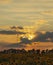 Sky at sunset with the rays of the sun and storm clouds, evening sun