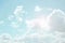 Sky. White clouds and sun rays in a light blue sky. The sky is in light pastel colors. Heaven background.