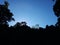 Sky with white rainy clouds in the green farmland. close up view of cloud,