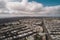 sky with wispy clouds, aerial view of cityscape, and drone