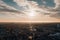 sky with wispy clouds, aerial view of cityscape, and drone