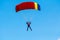 Skydiver and colorful parachute