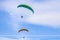 Skydiver On Colorful Parachute In Sky