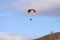 Skydiver On Colorful Parachute In Sky