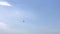 Skydiver flies against the sky
