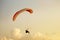 Skydiver flies on background of the cloudy sky