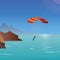 Skydiver flies over the sea and mountains. parachuting and extreme sport