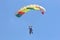 Skydiver flying wing in a blue sky