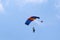 Skydiver flying wing in a blue sky