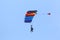 Skydiver flying wing in a blue sky