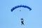 Skydiver flying wing in a blue sky