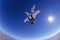 Skydiver free falling upside down portrait view from below