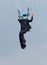 Skydiver hanging from parachute focusing and aiming for perfect