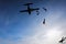 Skydiver jumping from the plane at the sunset