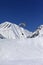 Skydiver landing on ski slope