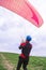 Skydiver pulls parachute behined him after landing