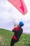 Skydiver pulls parachute behined him after landing