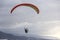 Skydiver in the sky. Silhouette of parachute on sunset background