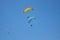 Skydivers on a blue sky background