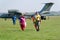 Skydivers carries a parachute after landing