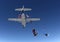 Skydivers jump from the plane