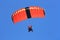 Skydivers parachuting down to the Earth in tandem jump