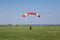 Skydivers parachutist on blue sky on sunset