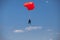 Skydivers parachutist on blue sky on sunset