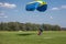 Skydivers parachutist on blue sky on sunset