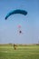 Skydivers parachutist on blue sky on sunset