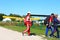 Skydivers ready to jump and go to the aircraft against a yellow plane