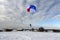 Skydiving. A circle color parachute is landing.