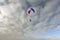 Skydiving. A circle color parachute is landing.