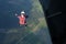 Skydiving. A skydiver is jumping out of a plane.