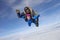 Skydiving. Tandem jump. Two people are in the sky.