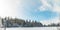 Skying resort hotel apartments building in winter time forest fairy tale scenic landscape environment near frozen lake in snow