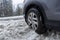 Skykomish, WA USA - circa January 2022: Angled view of a Honda CRV tire stuck in a snow drift during a harsh winter storm in the